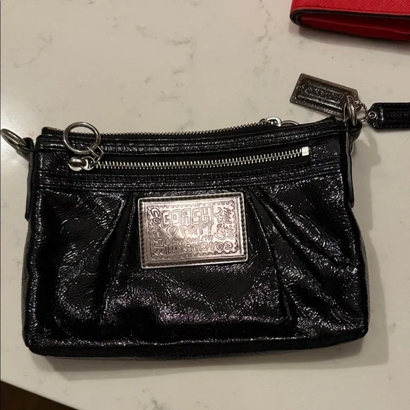 Coach Shimmering Black Wristlet with Silver Accents - Picture 1 of 1